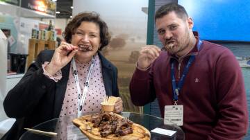 WA Agriculture and Food Minister Jarvis eating Fletcher International Exports lamb with Jonny Armitage, Head of Procurement Woods Food Services, at the International Food Event in London.