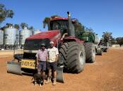 Neville (left) and Jim Hamilton, with Ginger the Kelpie, are taking a slow and steady approach to canola and lupin sowing this week.