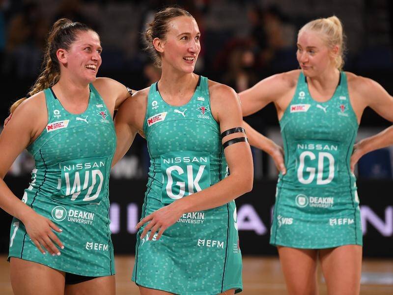 Cellar dwellers Melbourne celebrate their stunning win over the Super Netball-leading Lightning.
