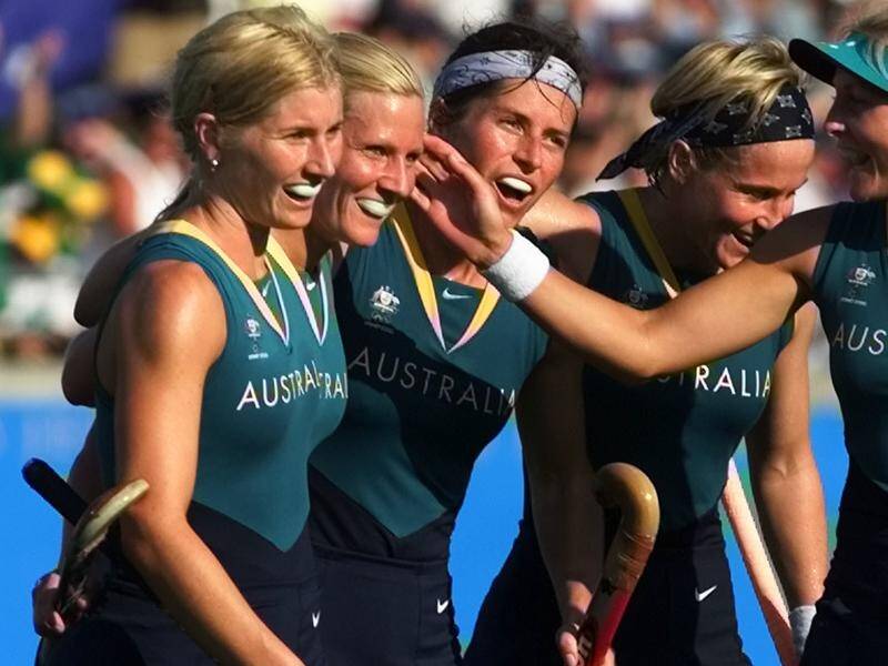 Hockey great Juliet Haslam (c), seen here playing in 2000, will set up Port Adelaide's AFLW program.